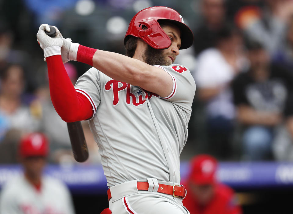 Philadelphia Phillies' Bryce Harper strikes out against Colorado Rockies starting pitcher Jon Gray in the fourth inning of a baseball game Sunday, April 21, 2019, in Denver. (AP Photo/David Zalubowski)