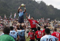In this Sunday Aug. 19, 2018, photo, Yamaha Jubilo's Kuwano Eishin, top left, is lifted to receive a high ball during a memorial match against the Kamaishi Seawaves at Kamaishi Recovery Memorial Stadium in Kamaishi, northern Japan. Japan opened the new stadium Sunday for the 2019 Rugby World Cup on the site of a school that was destroyed by a devastating tsunami in 2011. The teams faced off in a memorial match in the small coastal city of Kamaishi to honor victims of the deadliest disaster in Japan's recent history. (AP Photo/Koji Ueda)