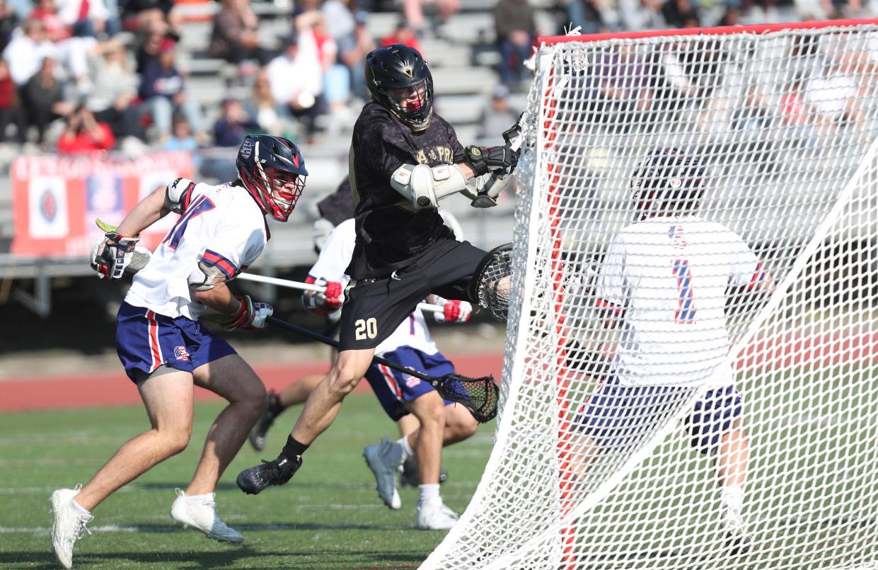 Iona's Tim Plunkett (20) fires a shot for a second half goal against Stepinac during the CHSAA New York AA championship game at Archbishop Stepinac High School in White Plains May 18, 2023. Iona won the game 8-7.