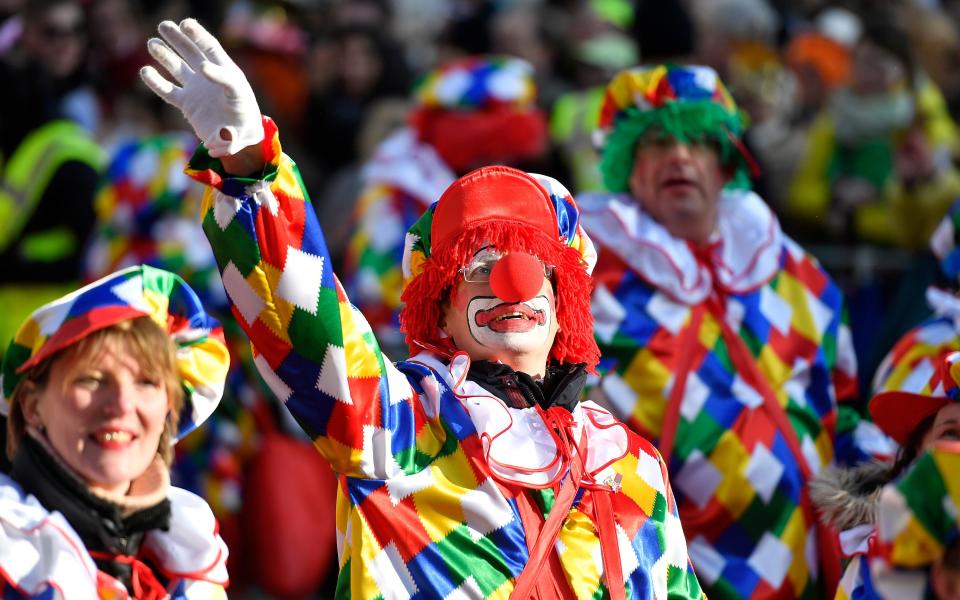 A reveller dressed as a clown waves during the traditional Rose Monday parade in Düsseldorf, Germany - Copyright 2018 The Associated Press. All rights reserved.