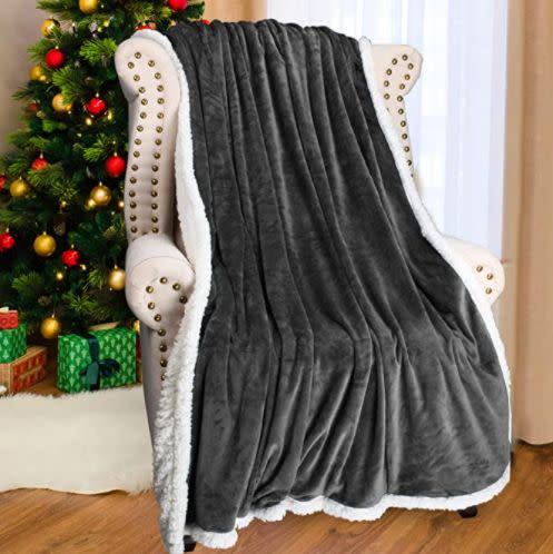 Find this <a href="https://amzn.to/2Wh3CkE" target="_blank" rel="noopener noreferrer">Grey Sherpa Fleece Throw Blanket for $27</a> on Amazon.