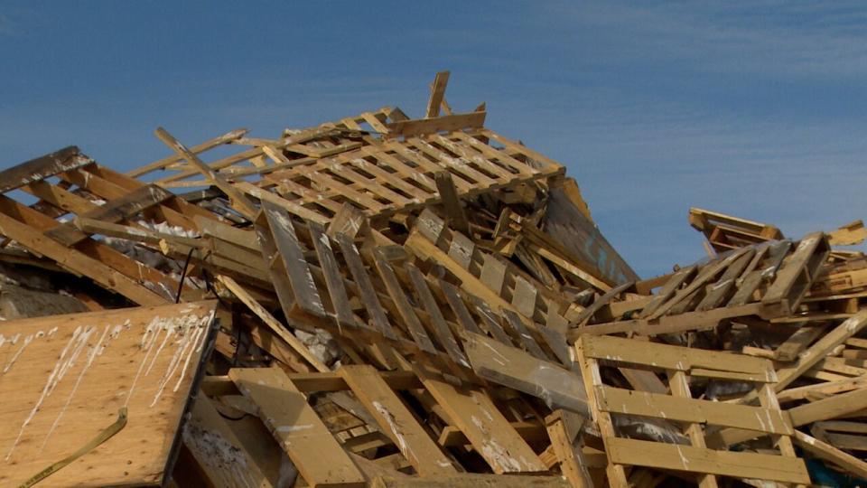 Vaughn said wood pallets are shredded and, along with yard waste and unsold cardboard, are added to organics to improve the quality of the soil that's generated. It's part of Yellowknife's waste diversion efforts at the dump. 