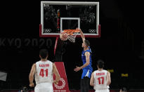 Czech Republic's Tomas Satoransky, center, shoots the ball during men's basketball game against Iran at the 2020 Summer Olympics, Sunday, July 25, 2021, in Saitama, Japan. (AP Photo/Eric Gay)