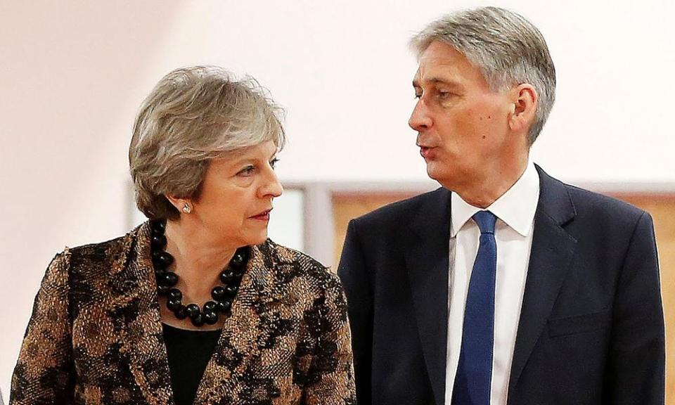 Theresa May and Philip Hammond at an engineering training facility yesterday