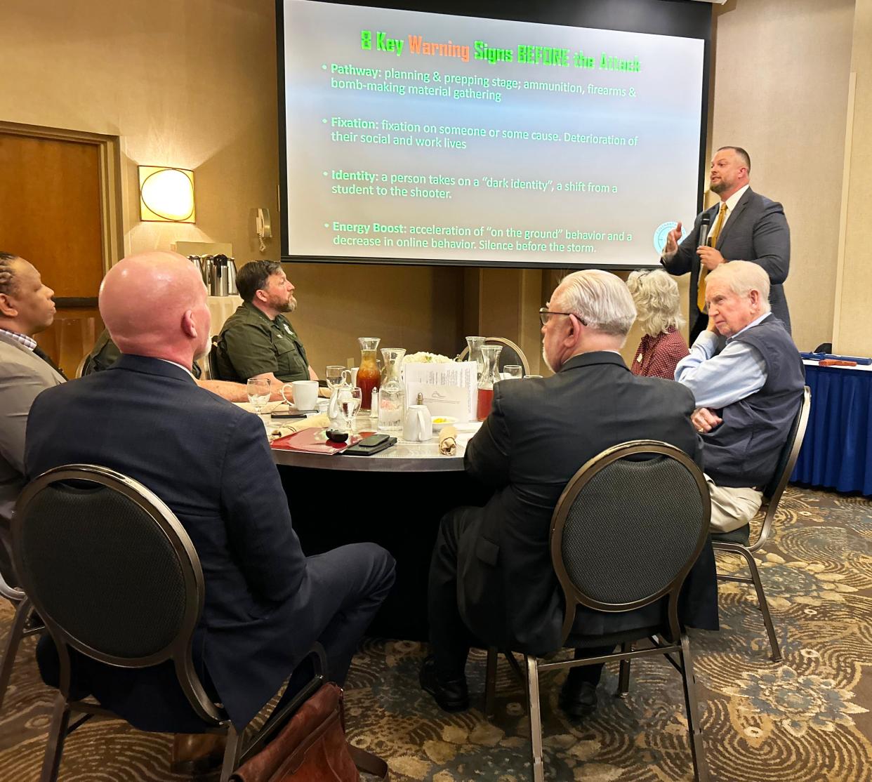 Brandon Ingram, standing at right, gives a presentation on school safety and school shooters at the meeting of Altrusa International of Oak Ridge on April 24 at the Doubletree by Hilton Hotel in Oak Ridge. Ingram is director of security for Covenant Health, parent company of Methodist Medical Center of Oak Ridge.