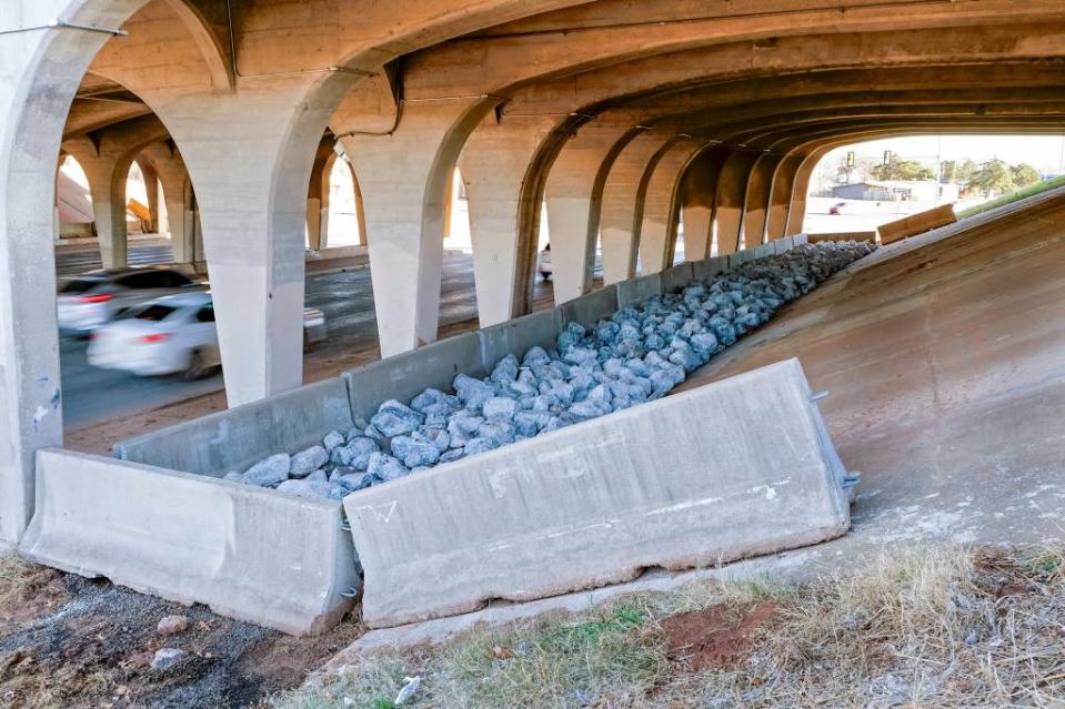 In Oklahoma, barriers and rocks block a recently cleared encampment under the I-44 bridge over North Pennsylvania Avenue in December, an attempt to keep homeless people from returning. (Photo by Doug Hoke/USA Today Network).