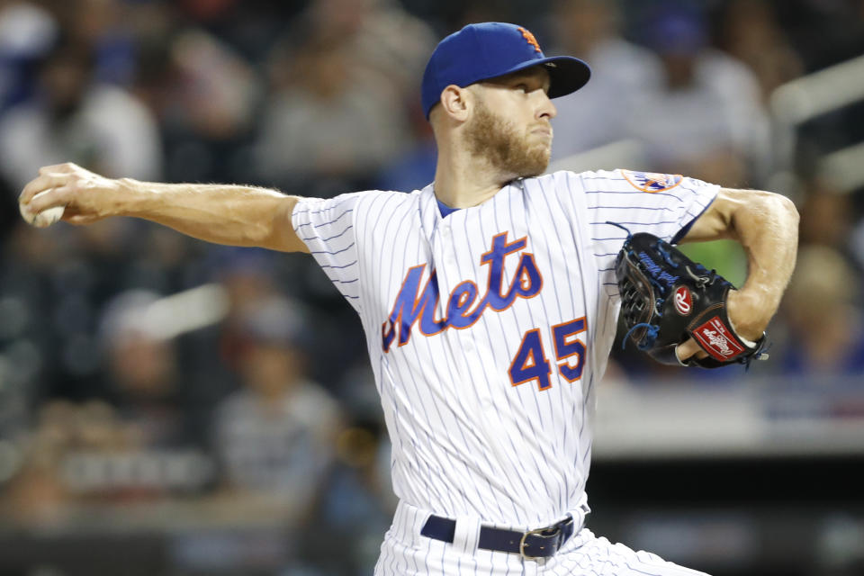 New York Mets starting pitcher Zack Wheeler (45) winds up during the first inning of a baseball game against the Los Angeles Dodgers, Sunday, Sept. 15, 2019, in New York. (AP Photo/Kathy Willens)