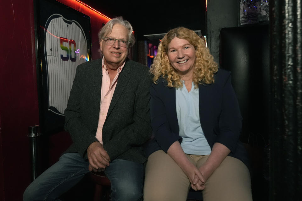 Stonewall Inn co-owners Kurt Kelly, left, and Stacy Lentz pose for a portrait inside the Stonewall Inn, Monday, June 17, 2024, in New York. The space next door to the bar will open as the new visitor center for the Stonewall National Monument on Friday, June 28, the anniversary of the 1969 rebellion that helped reshape LGBTQ+ life in the United States.The pair see the visitor center as a fitting neighbor and hope it will draw more people to the site and the bar. (AP Photo/Pamela Smith)