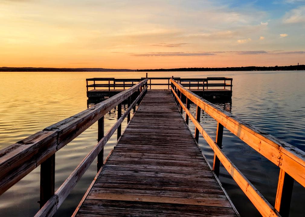 Sunrise on wooden fishing dock. 