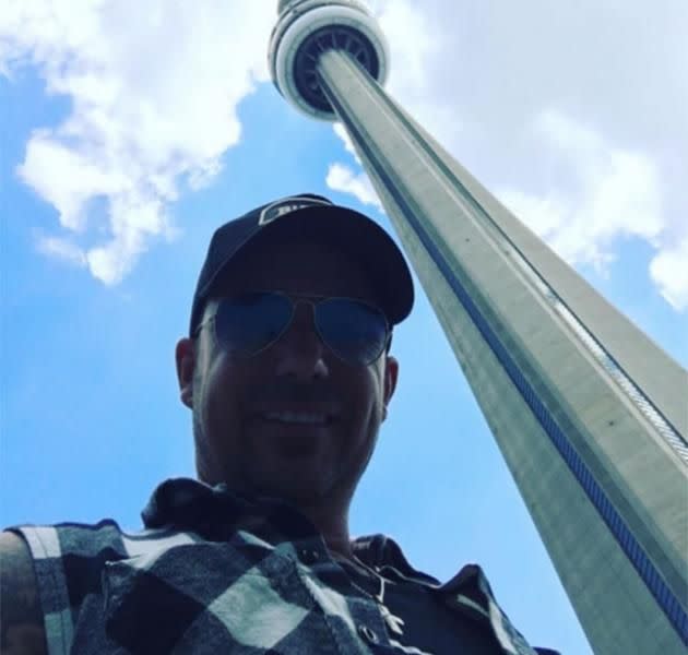 Jeremy Bieber, shared this photo of himself standing next to the CN Tower, and tagged his son in it. Source: Instagram