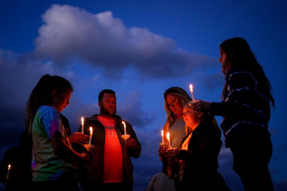 PHOTO: People gather at a vigil in Lisbon Falls, Maine, for the victims of this week's mass shootings, Saturday, Oct. 28, 2023. (Matt Rourke/AP)