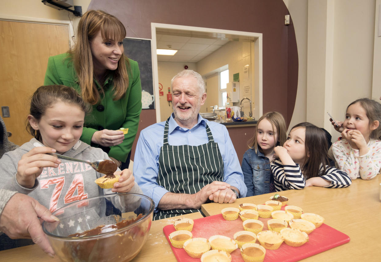 Labour leader Jeremy Corbyn and shadow education secretary Angela Rayner during a cooking lesson visit a children's holiday club at The Leyland Project in Leyland, Lancashire. (Photo by Danny Lawson/PA Images via Getty Images)