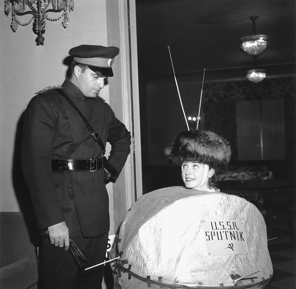 <p>Since Sputnik launched October 4, 1957, it's no surprise that party-goers got creative by donning Sputnik-inspired costumes just weeks later. Here, a "Sputnik" and a soviet officer attend a Halloween party in California.</p>