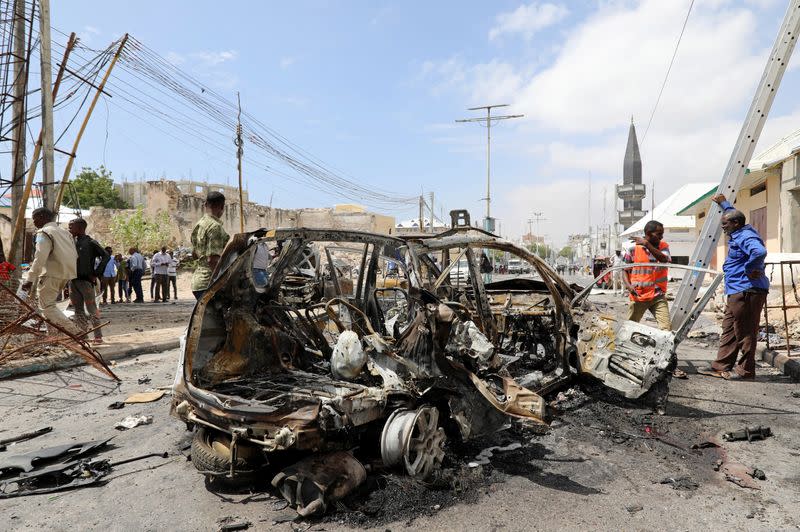 The wreckage of a car is seen at the scene of a bomb explosion at the Maka al-Mukarama street in Mogadishu