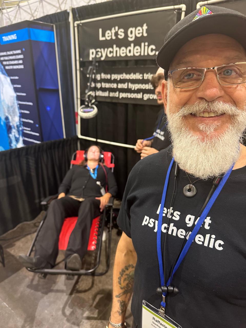 Raffaele Gianfrancesco offered attendees at the Cannabis Science Conference in Providence the calming experience of "brainwave entrainment" without using psychedelic drugs, but instead by using his "Roxiva" device, imported from Great Britain.  [Tom Mooney/The Providence Journal]