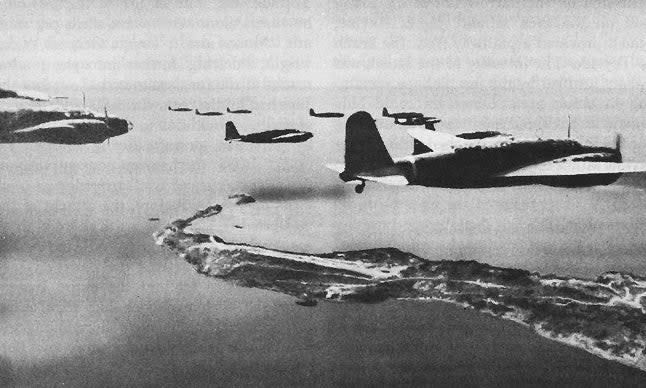 <em>Japanese bombers over Corregidor at the entrance to Manila Bay (Public Domain)</em>