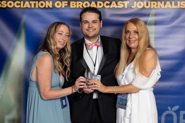 PHOTO: TV journalist Dylan Lyons, 24, poses for a photo with his girlfriend, left, and mom at the Florida Association of Broadcast Journalists awards ceremony on May 7, 2022 in Orlando, Fla. (Jonathan Galed/AP)