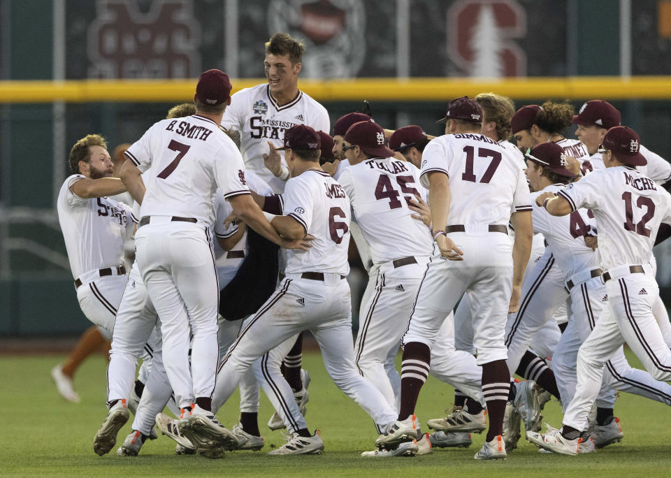 Mississippi State players celebrate their walk-off run to win against Texas during a baseball game in the College World Series Saturday, June 26, 2021, at TD Ameritrade Park in Omaha, Neb. (AP Photo/Rebecca S. Gratz)