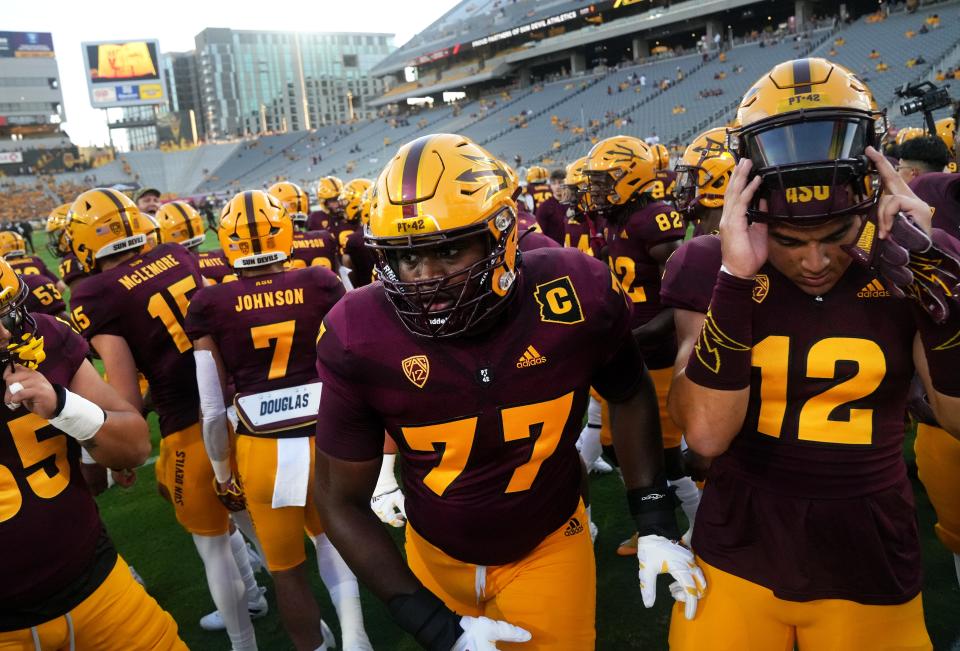 Sep 1, 2022; Tempe, Arizona, USA; Arizona State Sun Devil offensive lineman Ladarius Henderson (77) takes the field with his teammates before they play the Northern Arizona Lumberjacks at Sun Devil Stadium. Mandatory Credit: Joe Rondone-Arizona Republic