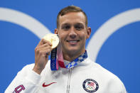 Caeleb Dressel, of United States, poses after winning the gold medal in the men's 50-meter freestyle final at the 2020 Summer Olympics, Sunday, Aug. 1, 2021, in Tokyo, Japan. (AP Photo/Gregory Bull)