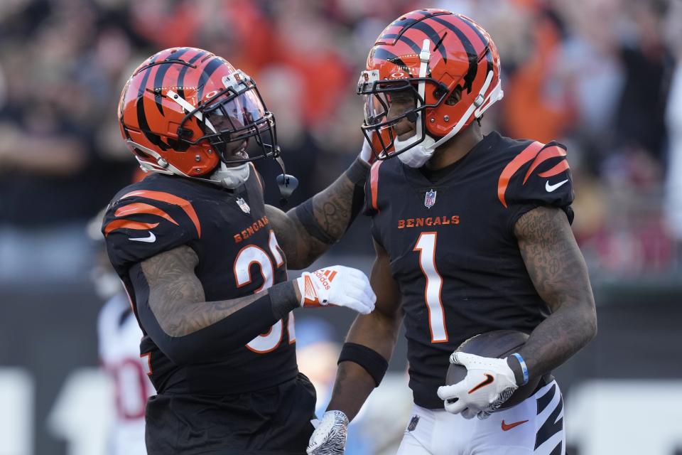 Cincinnati Bengals wide receiver Ja'Marr Chase (1) celebrates with Garret Wallow after scoring a touchdown against the Houston Texans during the second half of an NFL football game Sunday, Nov. 12, 2023, in Cincinnati. (AP Photo/Carolyn Kaster)