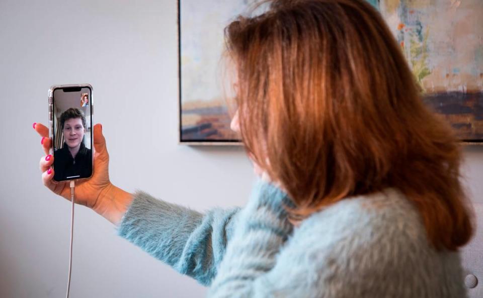 Suzanne Rose, right, speaks to her son Spenser on a video call in her Raleigh, NC home on Thursday, March 5, 2020. Spenser is a graduate of Appalachian State University and is pursuing a master’s degree at Wenzhou University in China’s Zhejiang province. When the coronavirus outbreak occurred in Wuhan, about 500 miles from Wenzhou, Rose weighed the risks of traveling and decided to stay put and follow local guidelines for isolation.