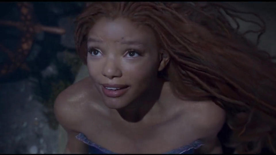 Halle Bailey's Ariel looks up to the surface in the live-action The Little Mermaid teaser