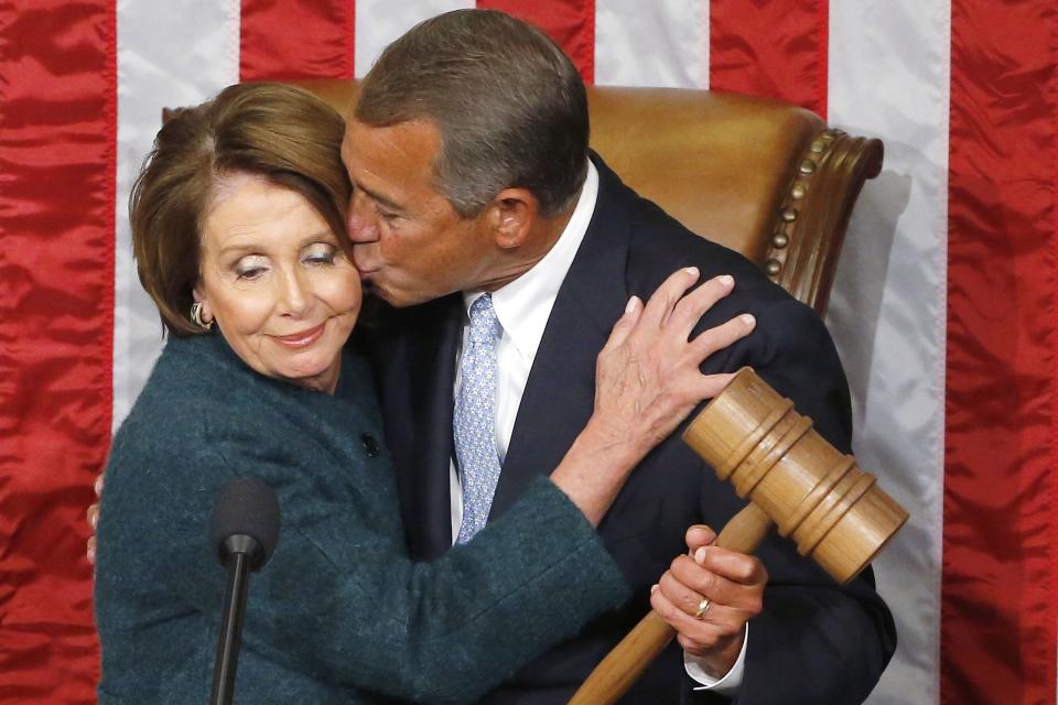 U.S. House Speaker John Boehner (R-OH) (R) kisses House Minority Leader Nancy Pelosi (D-CA), as he holds the gavel after being re-elected speaker on the House floor at the U.S. Capitol in Washington January 6, 2015. REUTERS/Jonathan Ernst (UNITED STATES - Tags: POLITICS TPX IMAGES OF THE DAY)