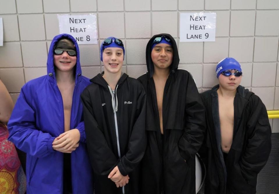Members of the 13-14 Boys 200 Freestyle and Medley Relay team, Issac Winey, Preston Kent, Diego Diaz-Cardenas, Bryan Anderson, pose for a photo during the Greater Iowa Swim League State Swim Meet on Saturday, March 11 in Des Moines.