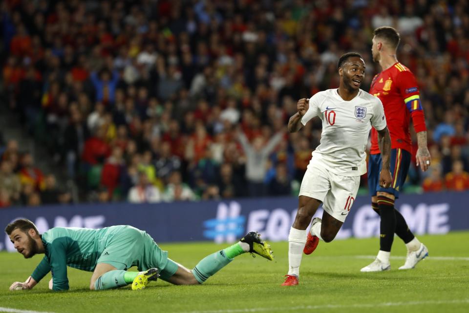 England's Raheem Sterling, left, celebrates after scoring his side's third goal during the UEFA Nations League soccer match between Spain and England at Benito Villamarin stadium, in Seville, Spain, Monday, Oct. 15, 2018. (AP Photo/Miguel Morenatti)