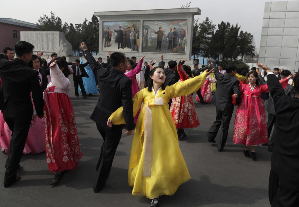 North Koreans dance during the election day at a polling station in Pyongyang, North Korea, Sunday, March 10, 2019. Millions of North Korean voters, including leader Kim Jong Un, are going to the polls to elect roughly 700 members to the national legislature. In typical North Korean style, voters are presented with just one state-sanctioned candidate per district and they cast ballots to show their approval or, very rarely, disapproval. (AP Photo/Dita Alangkara)