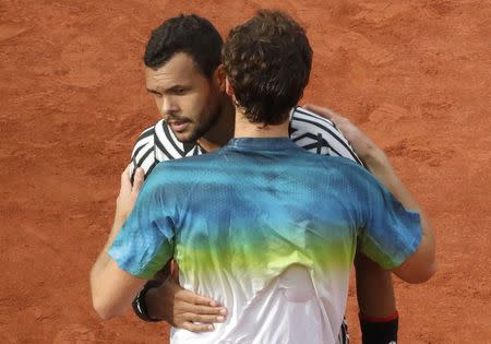 Tennis - French Open - Roland Garros - Latvia's Ernests Gulbis v Jo-Wilfried Tsonga - Paris, France - 28/05/16. Gulbis (R) comforts Tsonga who retires injured. REUTERS/Jacky Naegelen