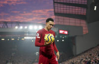Liverpool's Trent Alexander-Arnold holds the ball during the English Premier League soccer match between Liverpool and Manchester United at Anfield Stadium in Liverpool, Sunday, Jan. 19, 2020.(AP Photo/Jon Super)