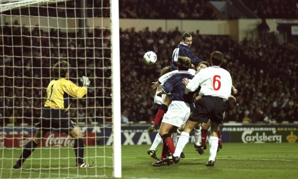 Don Hutchison guides a header past David Seaman to score Scotland’s goal at Wembley in 1999.