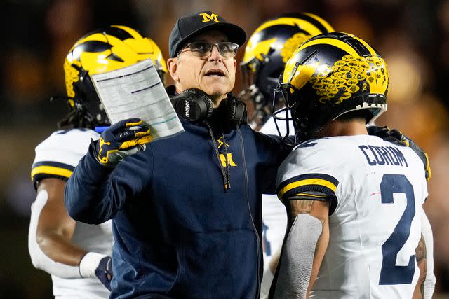 <p>AP Photo/Abbie Parr</p> Michigan head coach Jim Harbaugh