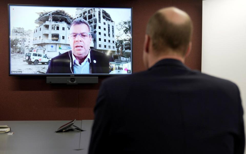 The Prince of Wales listens to Pascal Hundt, senior crisis manager of the International Committee of the Red Cross, on a video call from Gaza to the organisation's London HQ