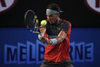 Rafael Nadal of Spain hits a return to Roger Federer of Switzerland during their men's singles semi-final match at the Australian Open 2014 tennis tournament in Melbourne January 24, 2014. REUTERS/Jason Reed