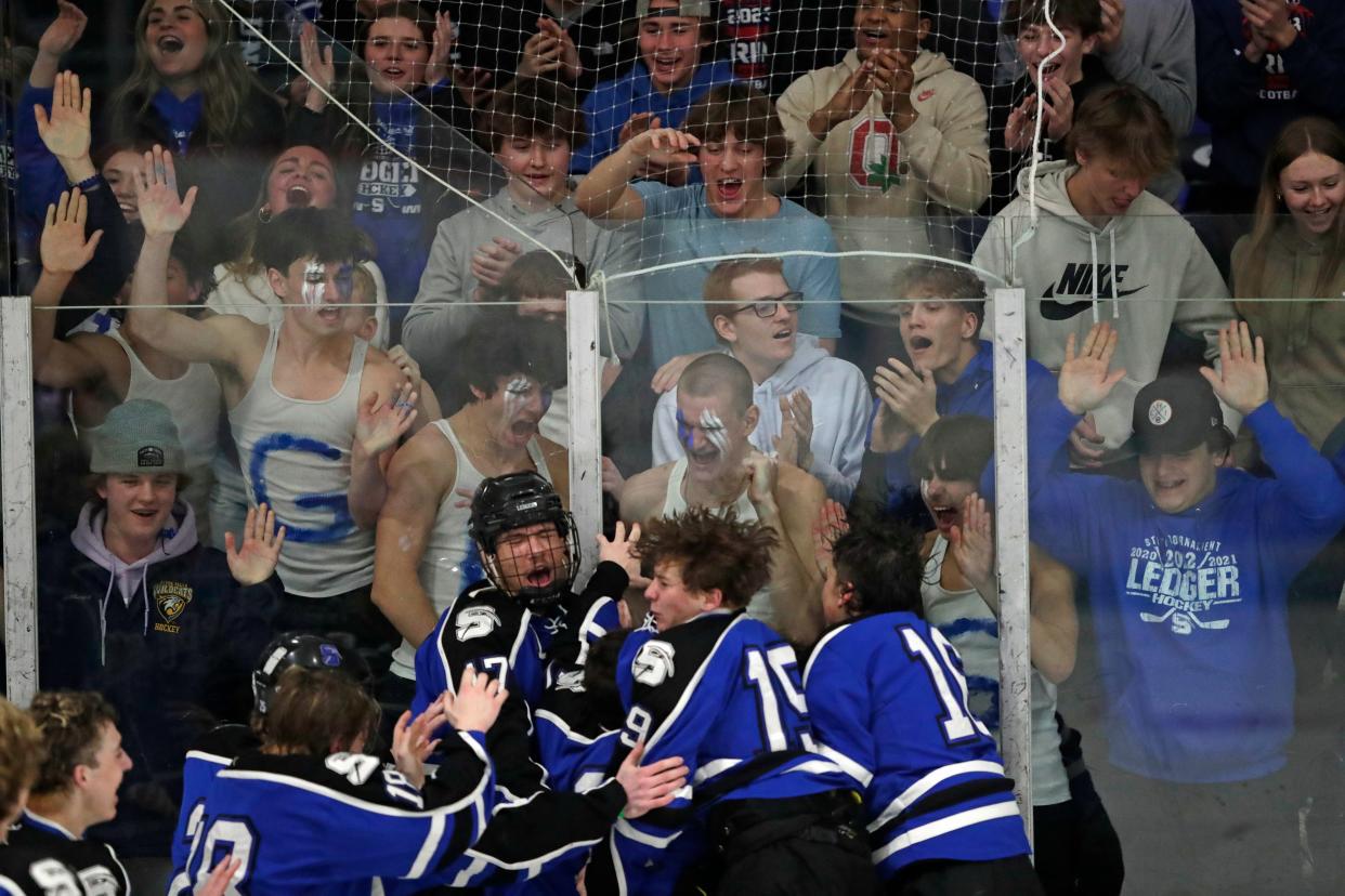 St. Mary's Springs Academy's players celebrate their victory against New Richmond High School during their WIAA Division 2 boys championship hockey game Saturday, March 2, 2024, at Bob Suter's Capitol Ice Arena in Middleton, Wisconsin.