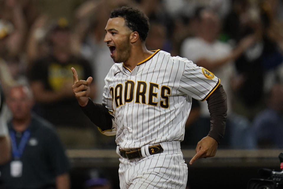 San Diego Padres' Trent Grisham celebrates after hitting a walk-off home run during the ninth inning of the second baseball game of a doubleheader against the Colorado Rockies, Tuesday, Aug. 2, 2022, in San Diego. (AP Photo/Gregory Bull)