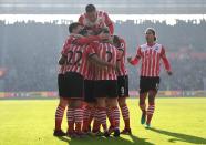 <p>The injury-prone winger celebrates scoring the Saints’ second goal with a fine half volley </p>