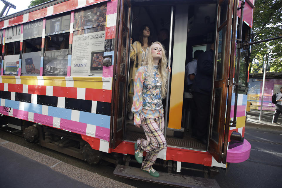 Models wear creations onboard a tram as part of the Missoni Spring-Summer 2020 collection, unveiled during the fashion week, in Milan, Italy, Thursday, Sept. 19, 2019. (AP Photo/Luca Bruno)