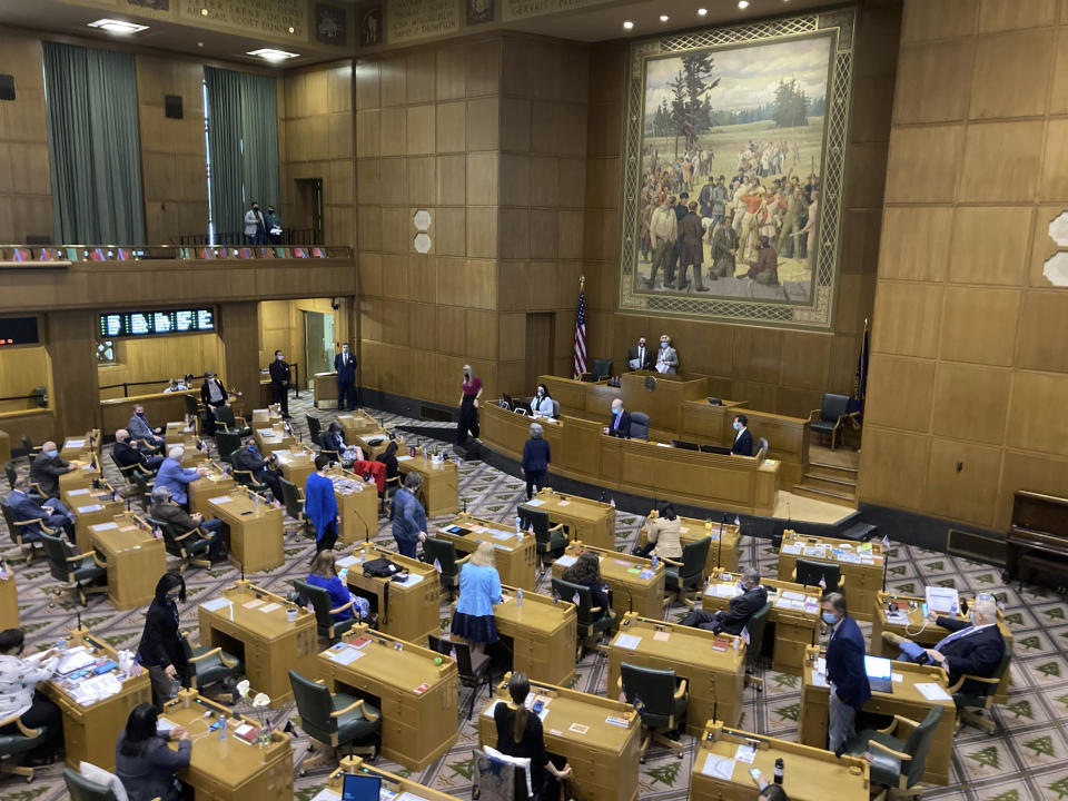 The Oregon House of Representatives get set to open a session on the evening of Thursday, June 10, 2021, to consider expelling member Rep. Mike Nearman for letting violent protesters into the Oregon Capitol in December. (AP Photo/Andrew Selsky)