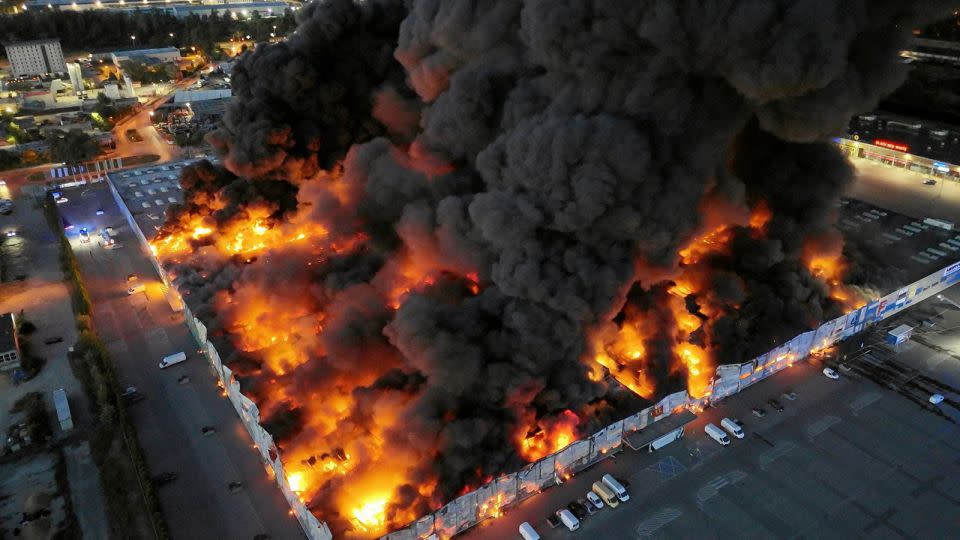 Drone view of the Marywilska 44 shopping centre burning during a massive fire in Warsaw, Poland, on May 12, 2024. - Dariusz Borowicz/Agencja Wyborcza.pl/Reuters