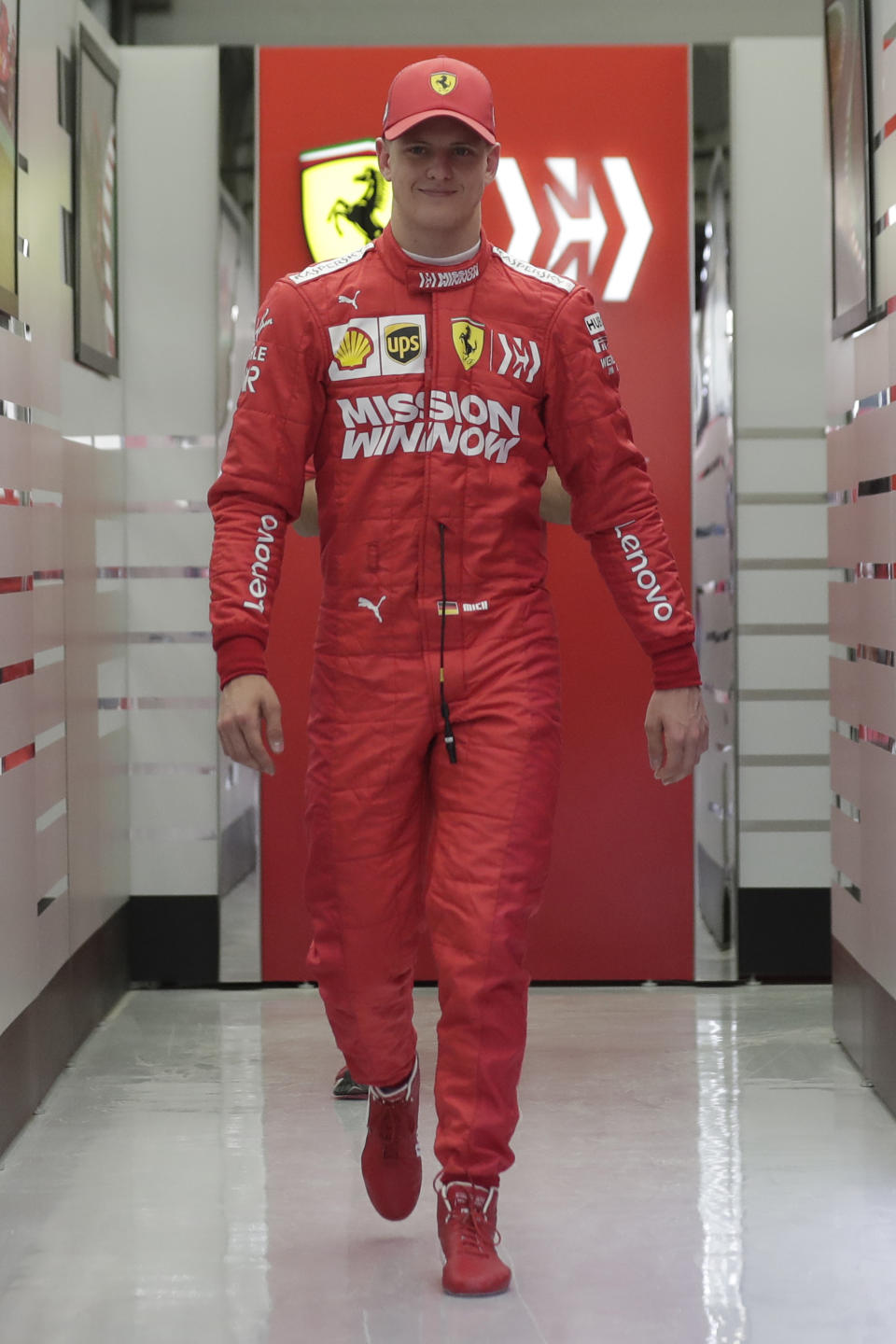 Mick Schumacher leaves Ferrari garage during his first F1 test for Ferrari at the Bahrain International Circuit in Sakhir, Bahrain, Tuesday, April 2, 2019. Mick Schumacher has moved closer to emulating his father Michael by driving a Ferrari Formula One car in an official test. Schumacher's father won seven F1 titles, five of those with Ferrari and holds the record for race wins with 91. (AP Photo/Hassan Ammar)