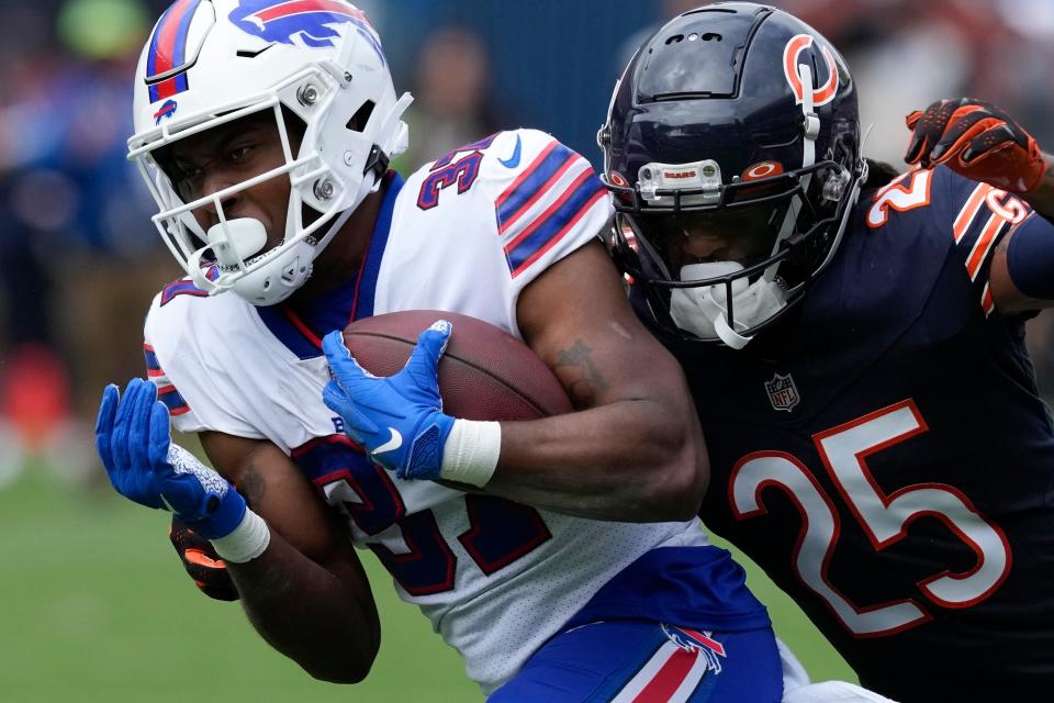 Buffalo Bills' Darrynton Evans scores a touchdown as he is tackled by Chicago Bears' Macon Clark during the second half of an NFL preseason football game, Saturday, Aug. 26, 2023, in Chicago.