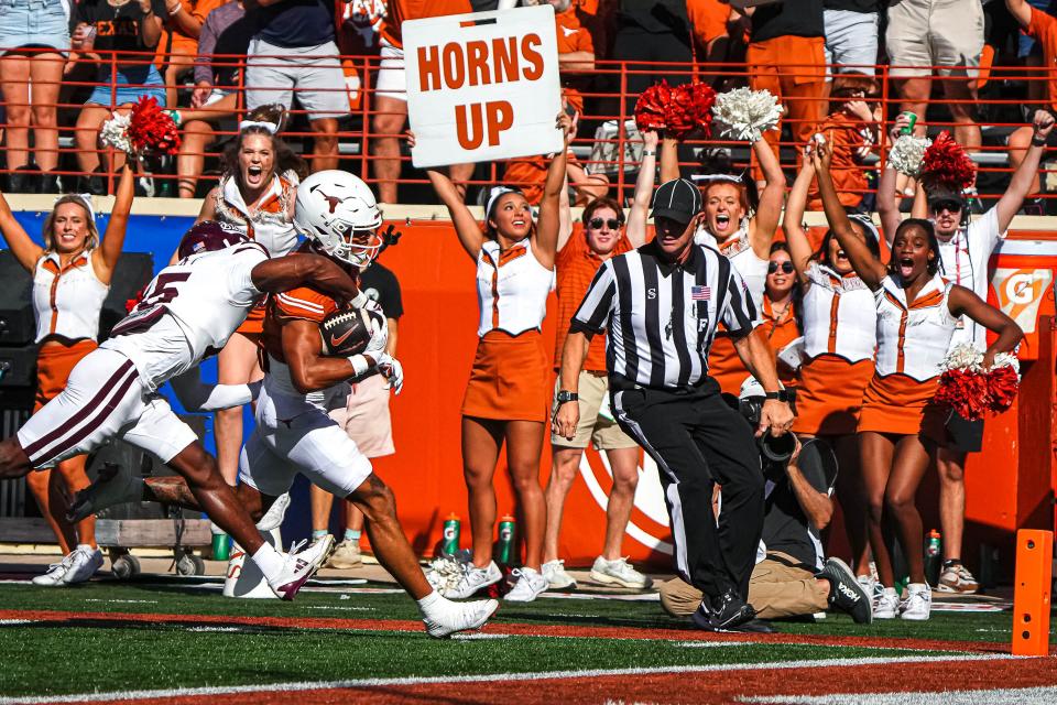 Texas wide receiver DeAndre Moore Jr. scores one of his two touchdowns in Saturday's 35-13 win over Mississippi State at Royal-Memorial Stadium. It was the Longhorns' SEC debut.