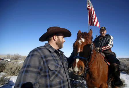 Leader of a group of armed protesters Ammon Bundy (L) greets occupier Duane Ehmer and his horse Hellboy at the Malheur National Wildlife Refuge near Burns, Oregon, January 8, 2016. REUTERS/Jim Urquhart