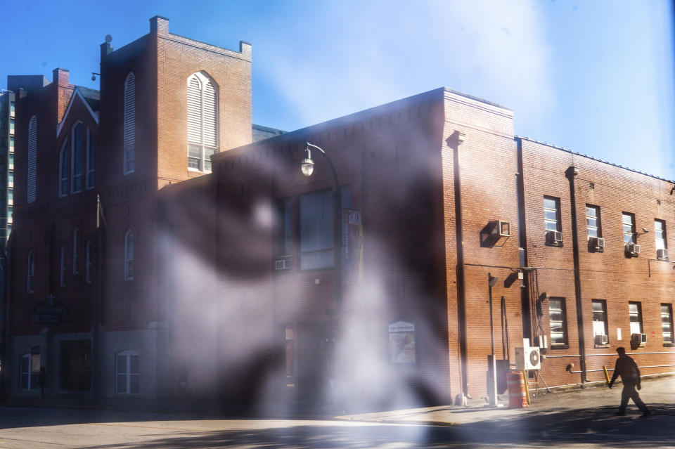 The Historic Ebenezer First Baptist Church is reflected in a photo of Martin Luther King Jr., Monday, Jan. 18, 2021, in Atlanta. (AP Photo/Branden Camp)