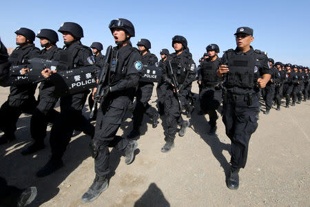 FILE PHOTO: Chinese soldiers participate in an anti-terror drill in Hami, Xinjiang Uighur Autonomous Region, China, July 8, 2017. REUTERS/Stringer