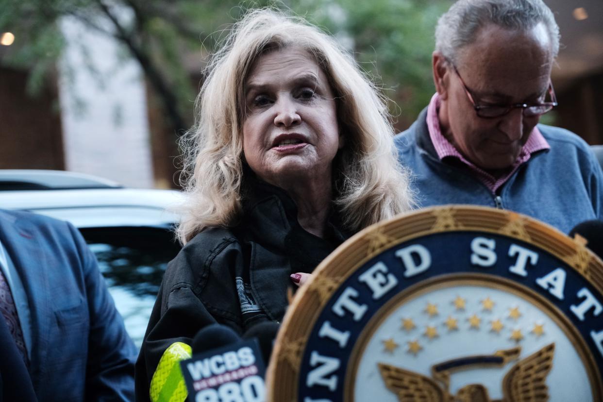 Rep. Carolyn Maloney (D-N.Y) in the foreground and Senate Majority Leader Chuck Schumer (D-N.Y.) in the background call on Congress to pass the 911 Responder and Survivor Health Funding Correction Act on September 10, 2021, in Manhattan, New York.